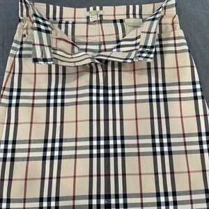 Women’s mid length Burberry skirt.